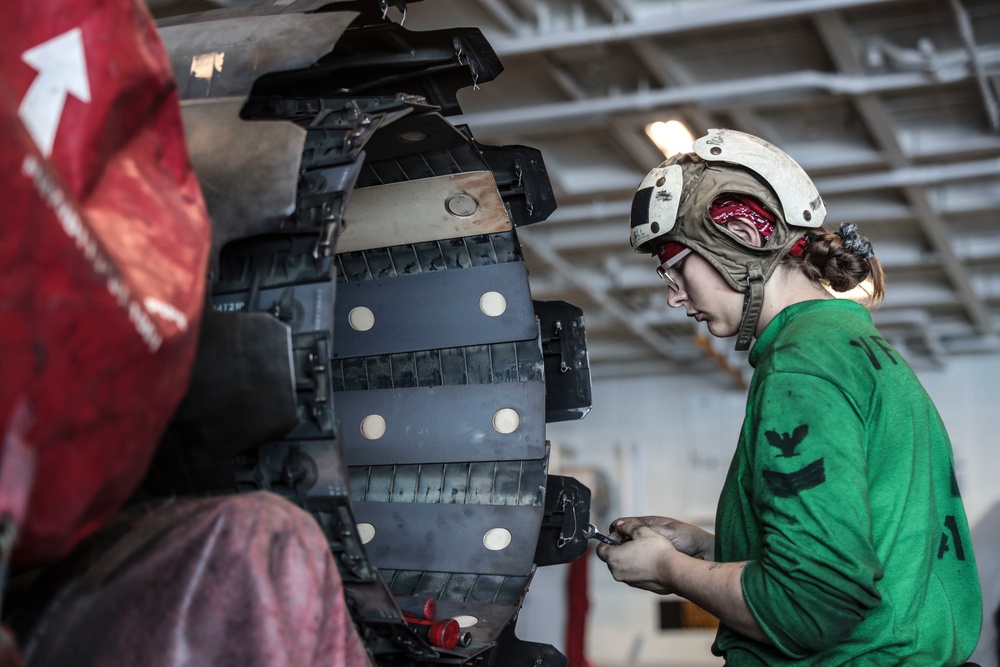 Abraham Lincoln Sailors conduct aircraft maintenance