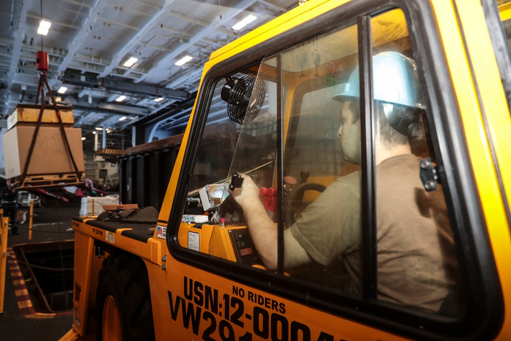 Abraham Lincoln Sailors conduct aircraft maintenance