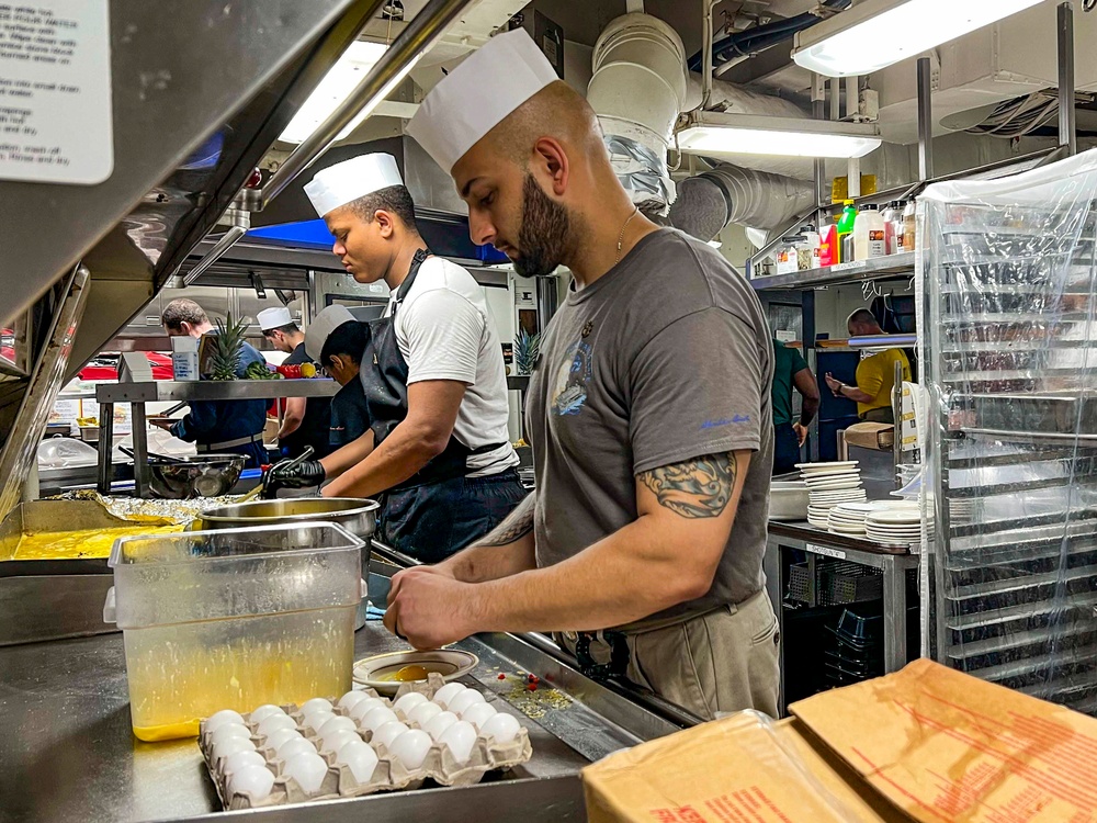 Abraham Lincoln Sailors serve food