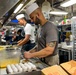 Abraham Lincoln Sailors serve food