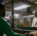 Abraham Lincoln Sailors serve food