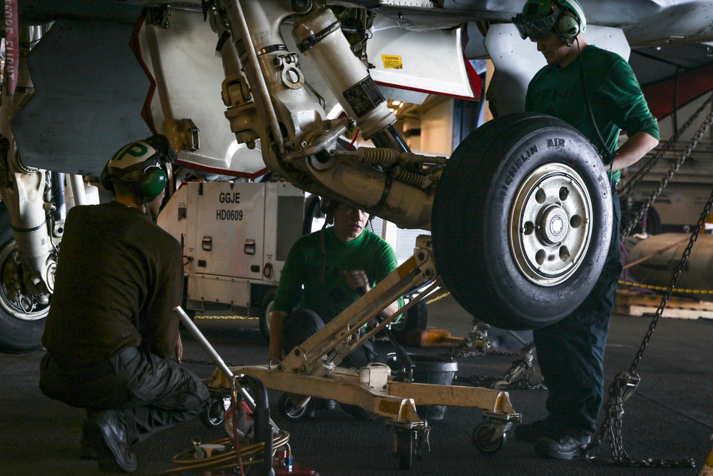 Abraham Lincoln Sailors conduct aircraft maintenance