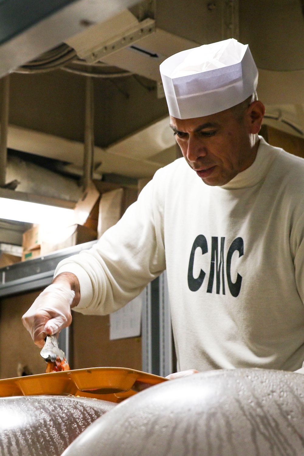 Abraham Lincoln Sailors serve food