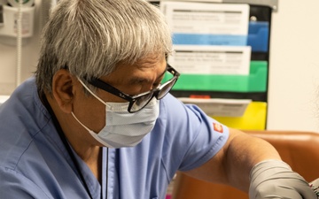 Tripler Nurse Administers COVID-19 Booster, May 2022