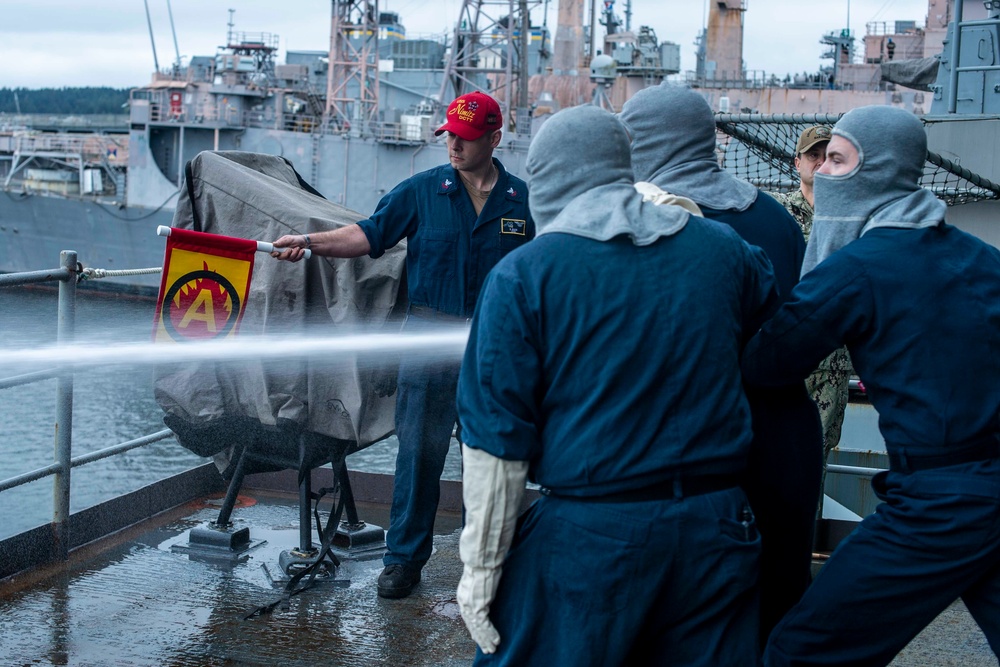 Sailors Conduct Drills On Fantail