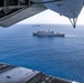 USS Arlington conducts replenishment-at-sea with CH-53E helicopters