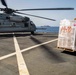 USS Arlington conducts replenishment-at-sea with CH-53E helicopters