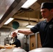 Abraham Lincoln Sailors serve food