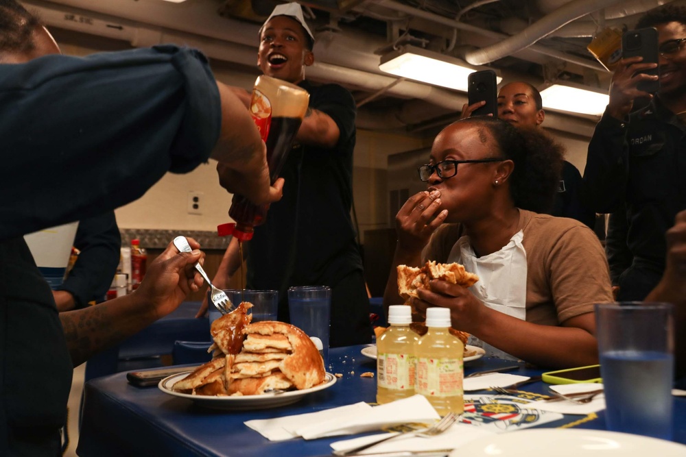 Mobile Bay Sailors compete in a pancake eating contest