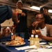 Mobile Bay Sailors compete in a pancake eating contest