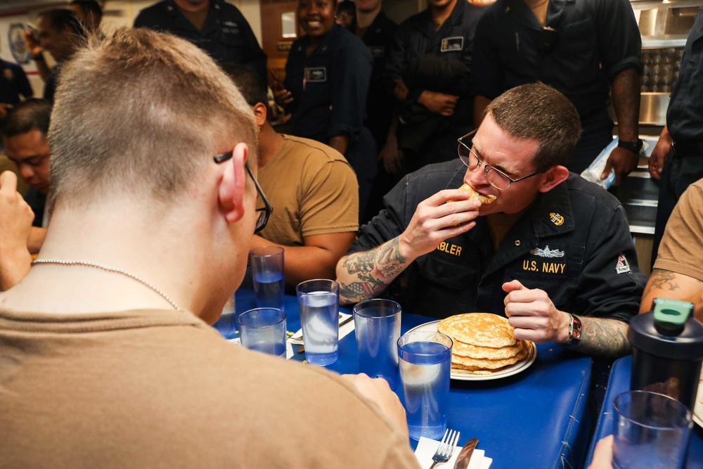 Mobile Bay Sailors compete in a pancake eating contest