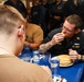 Mobile Bay Sailors compete in a pancake eating contest