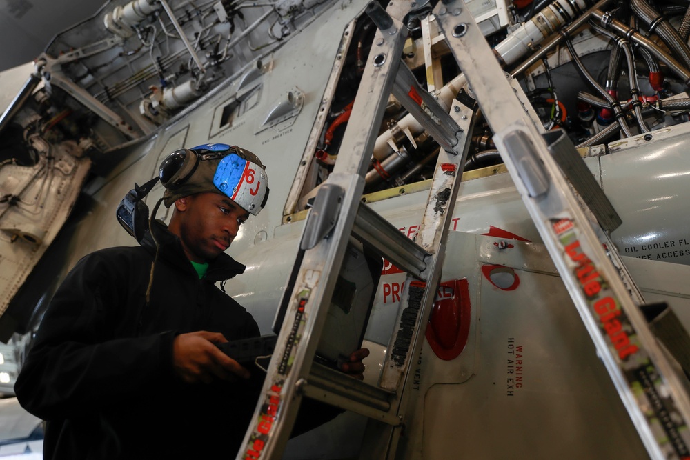 Abraham Lincoln Sailors conduct aircraft maintenance