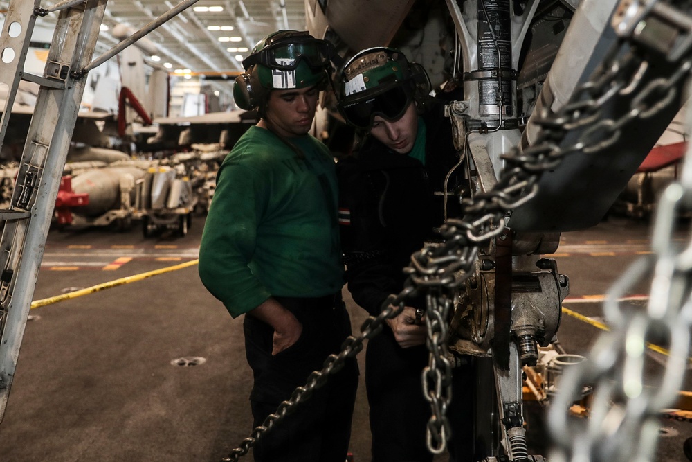 Abraham Lincoln Sailors conduct aircraft maintenance