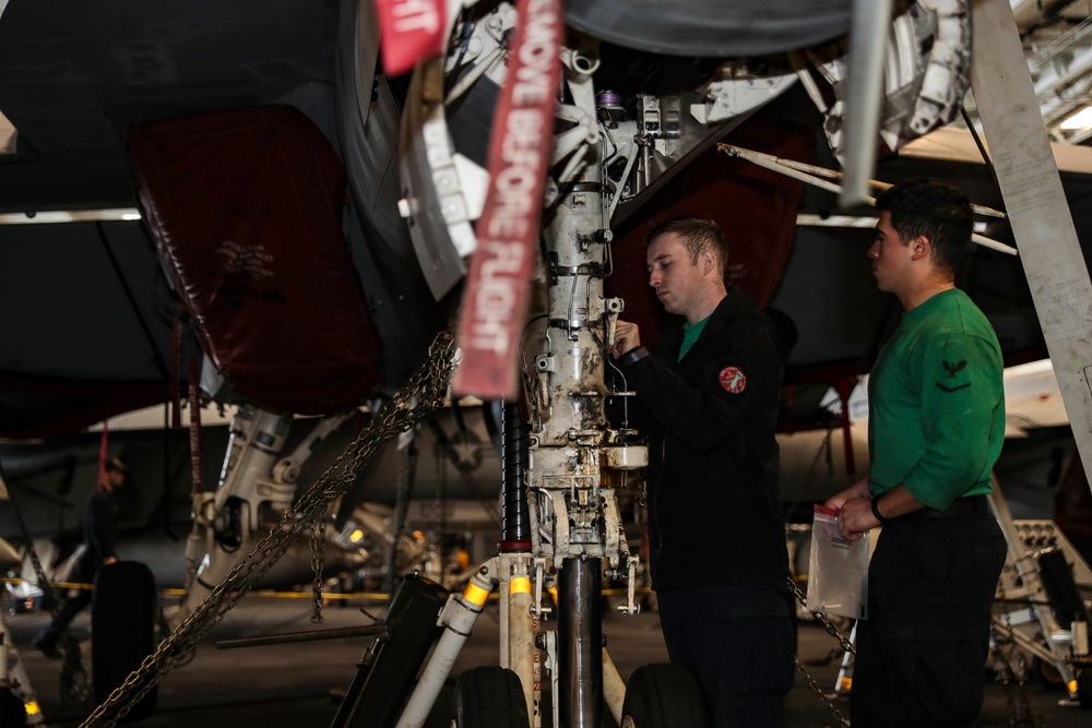 Abraham Lincoln Sailors conduct aircraft maintenance