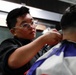 Abraham Lincoln Sailors give haircuts