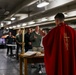 Abraham Lincoln Sailors participate in a Roman Catholic Mass service