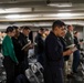 Abraham Lincoln Sailors participate in a Roman Catholic Mass service