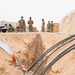 Roll Sleeves Up - 378th AEW leadership digs trenches with Comm