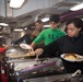 Abraham Lincoln Sailors serve food