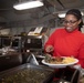 Abraham Lincoln Sailors serve food