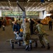 Sailors transport supplies in the hangar bay of Nimitz-class aircraft carrier USS Carl Vinson