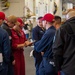 Sailors muster the in-port emergency training team in the hangar bay aboard of Nimitz-class aircraft carrier USS Carl Vinson