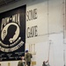 Sailors paint bulkheads in the hangar bay aboard of Nimitz-class aircraft carrier USS Carl Vinson