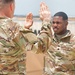 Fort Hood Soldier reenlists on top of the III Armored Corps Headquarters