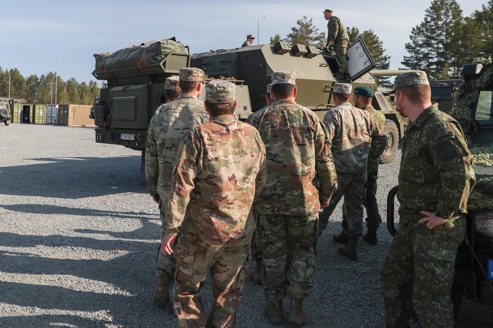 Slovakian NATO EFP soldiers demonstrate equipment to U.S. Soldiers