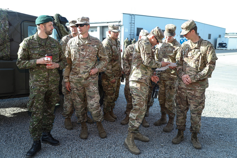 Slovakian NATO EFP soldiers demonstrate equipment to U.S. Soldiers