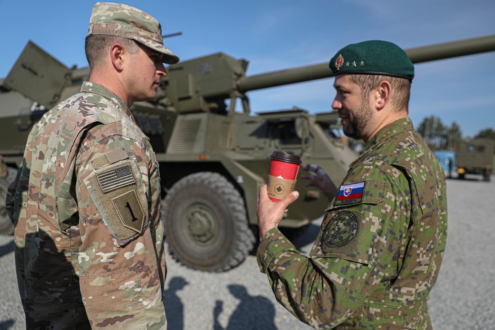 Slovakian NATO EFP soldiers demonstrate equipment to U.S. Soldiers