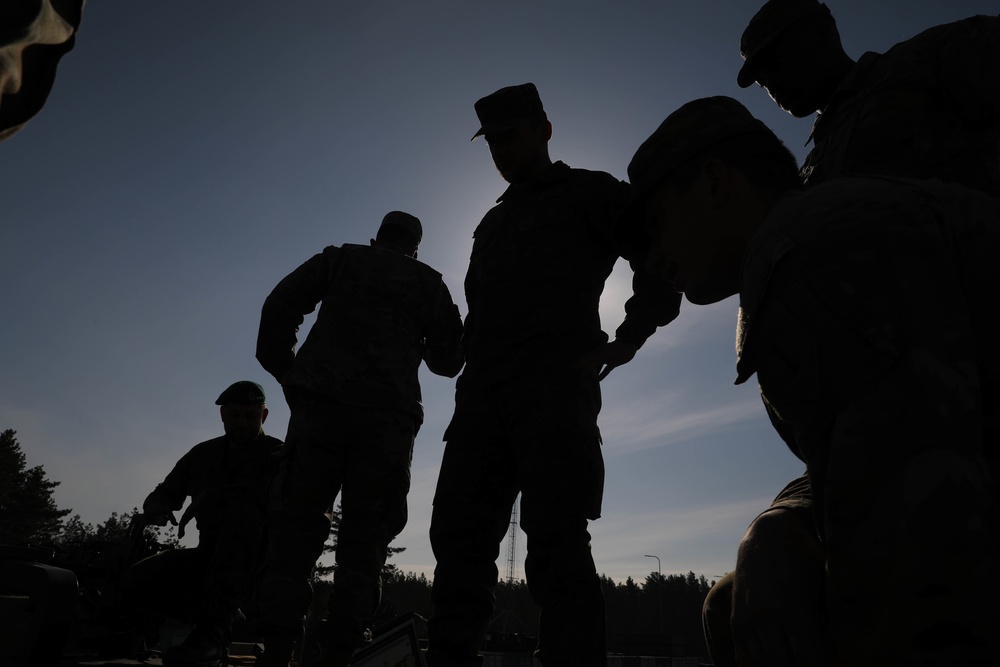 Slovakian NATO EFP soldiers demonstrate equipment to U.S. Soldiers