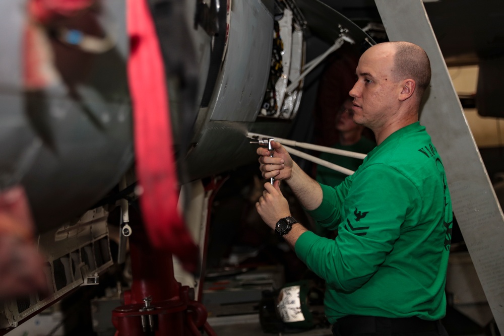 Abraham Lincoln Sailors conduct aircraft maintenance