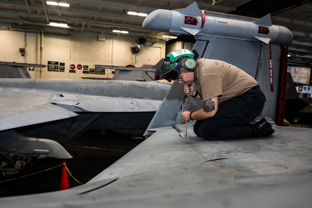 Abraham Lincoln Sailors conduct aircraft maintenance