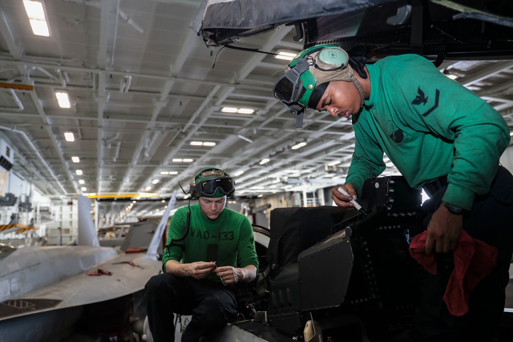 Abraham Lincoln Sailors conduct aircraft maintenance