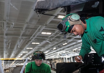 Abraham Lincoln Sailors conduct aircraft maintenance