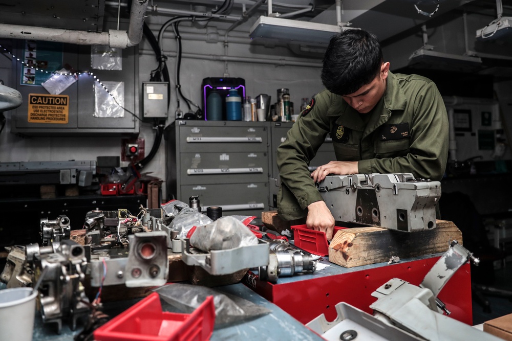 Abraham Lincoln Sailors conduct aircraft maintenance