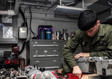 Abraham Lincoln Sailors conduct aircraft maintenance