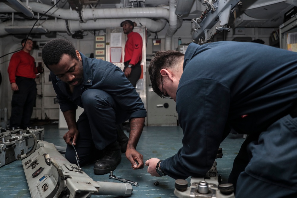 Abraham Lincoln Sailors conduct aircraft maintenance