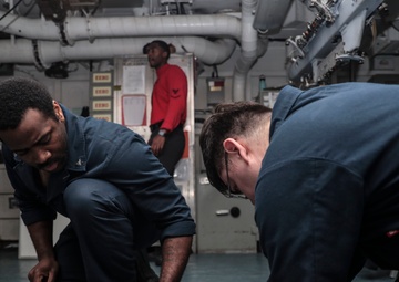 Abraham Lincoln Sailors conduct aircraft maintenance