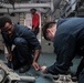 Abraham Lincoln Sailors conduct aircraft maintenance