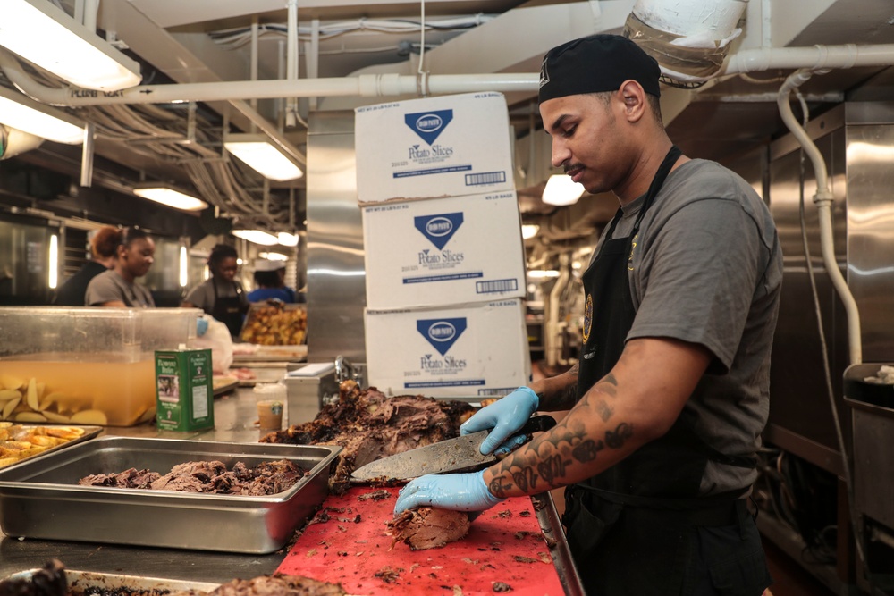 Abraham Lincoln Sailors serve food