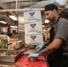 Abraham Lincoln Sailors serve food