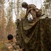 U.S. Army Soldiers camouflage Stryker for Exercise Arrow 22