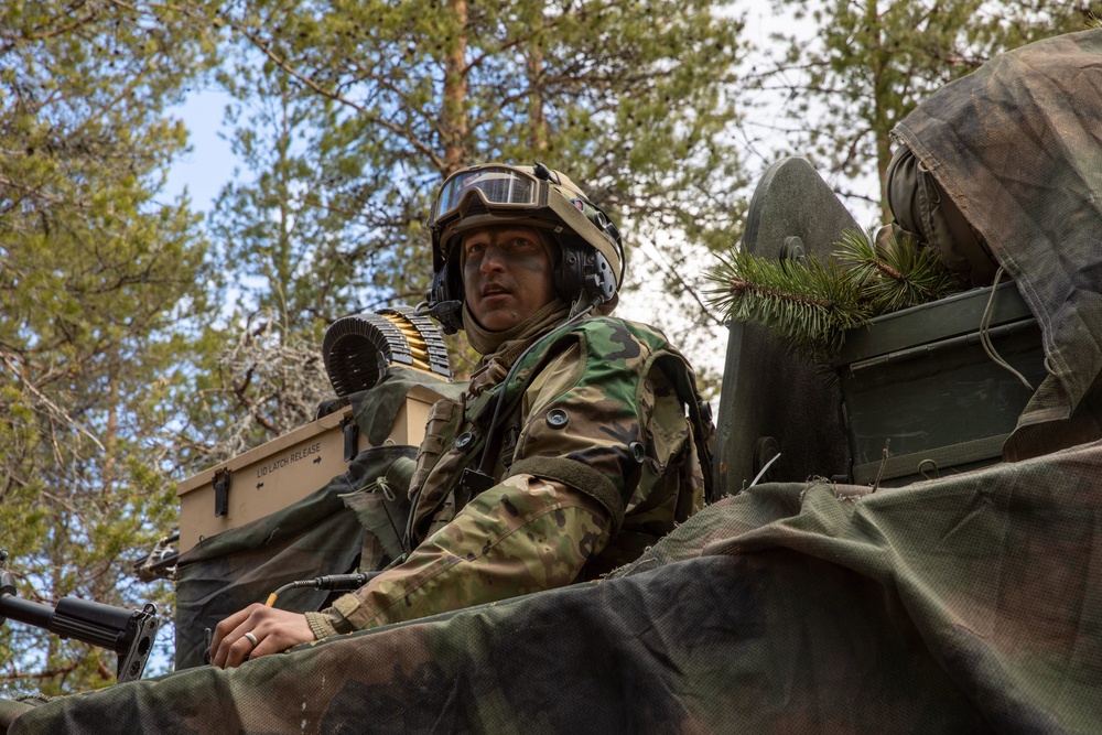 U.S. Army Staff Sgt. Ryan Cardiff aboard an M1126 during Exercise Arrow 22