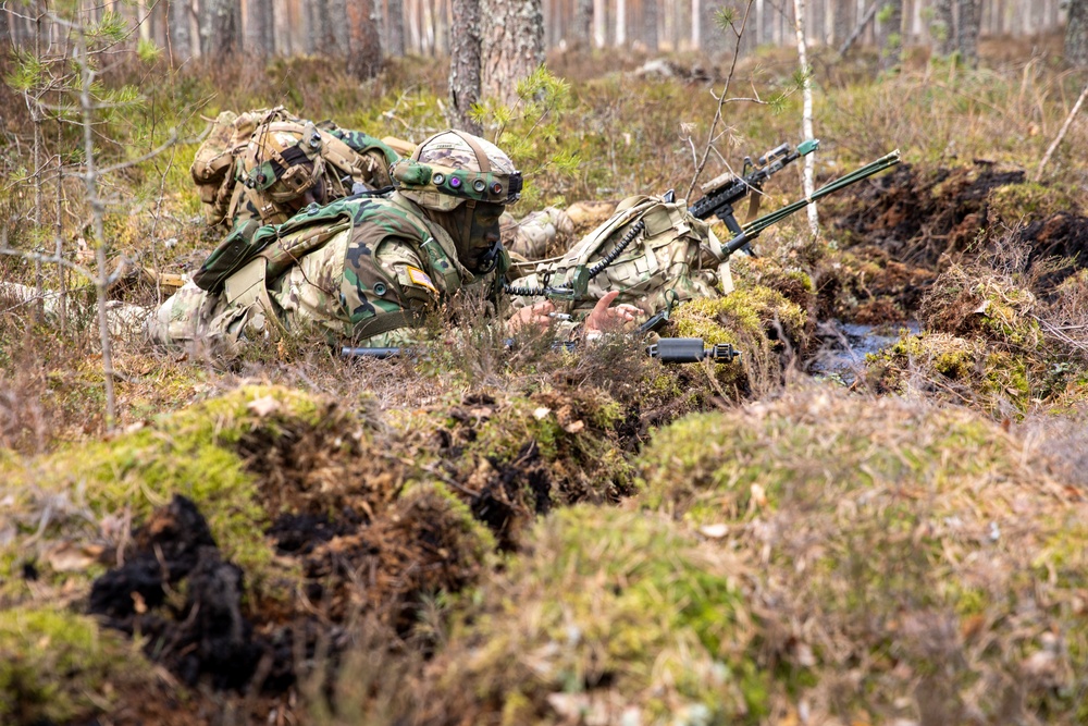 U.S. Army Staff Sgt. Devon Penrod communicates on his radio