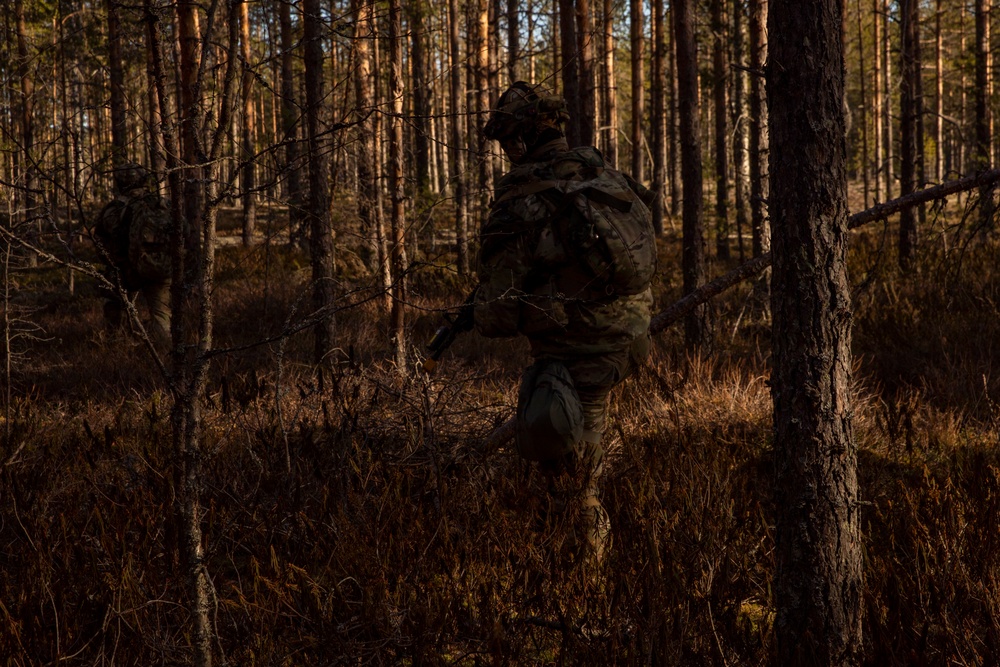 Camouflaged U.S. Army Soldiers of 4th Squadron, 2d Cavalry during Exercise Arrow 22