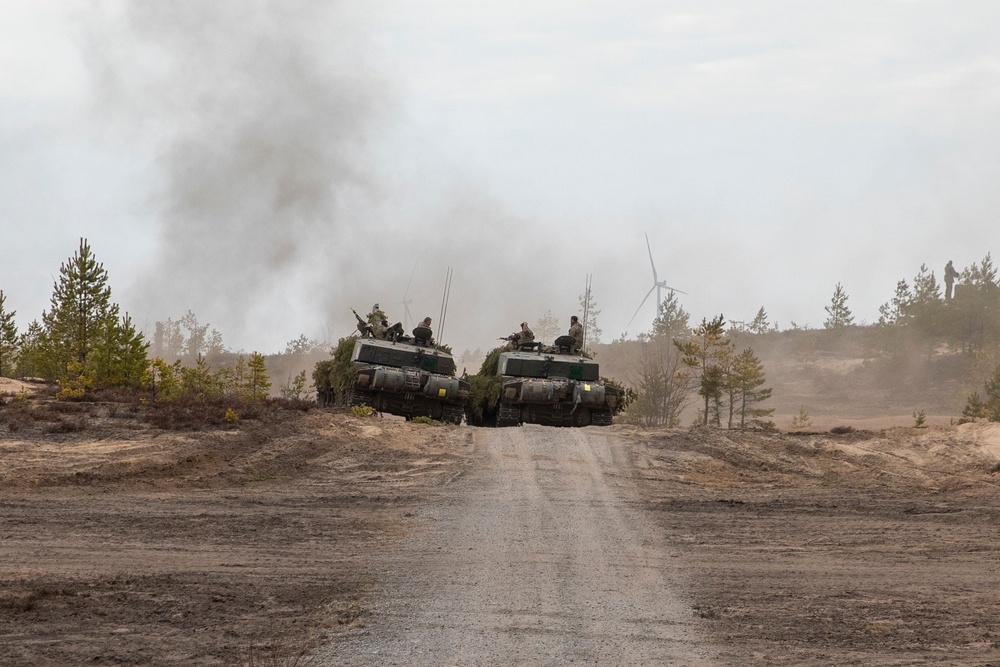 British soldiers in Challenger 2 tanks regroup at Exercise Arrow 22