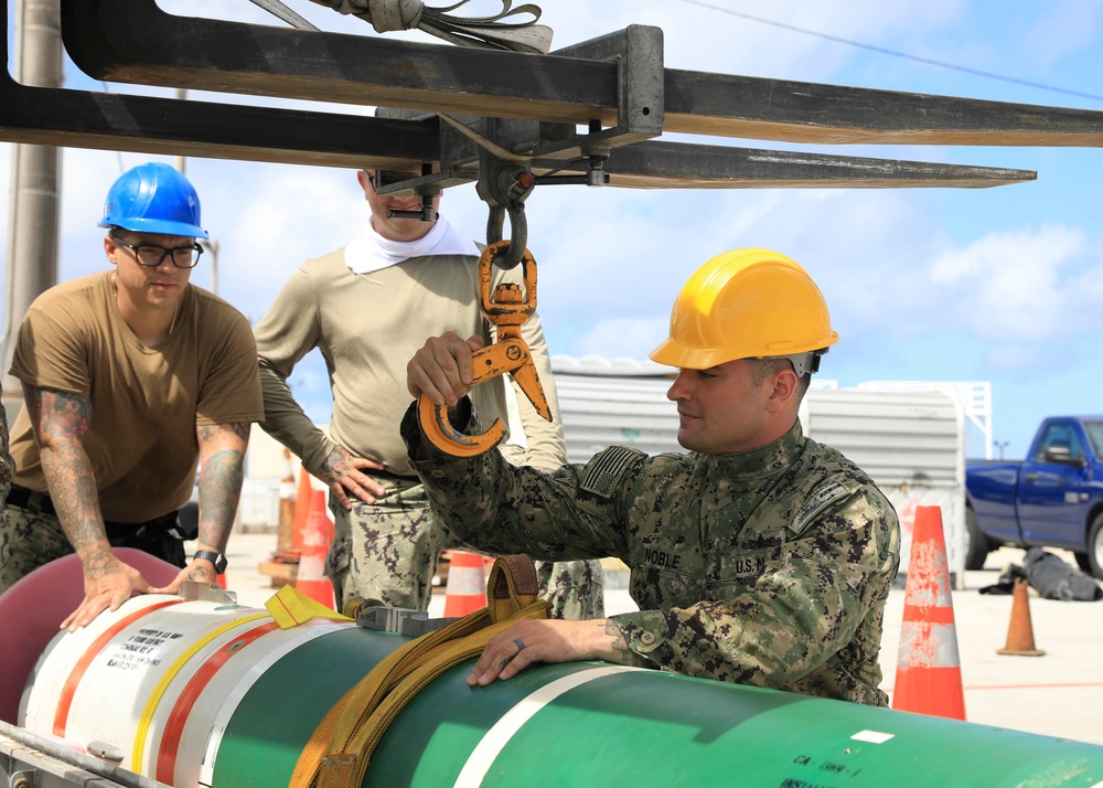 Sailors load mines on USS Annapolis